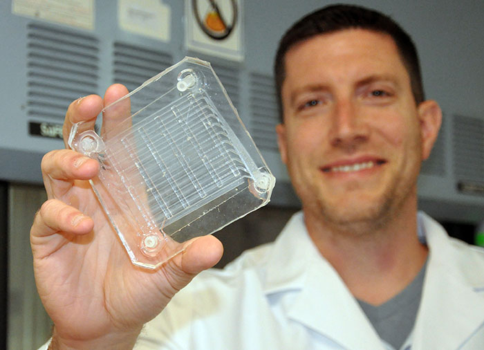 Dr. Potkay holding an artificial lung